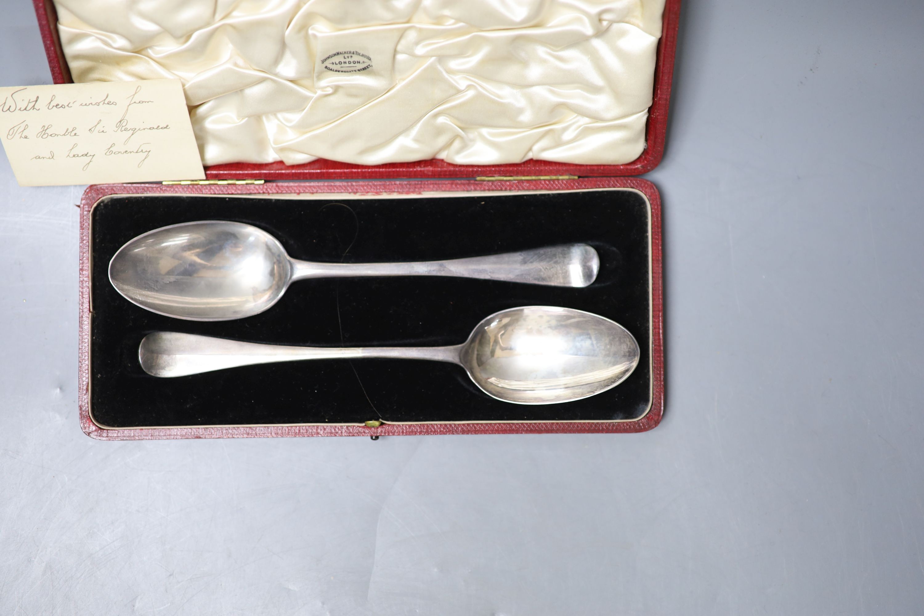 A cased matched pair of 18th century silver Hanovarian rat tail pattern tablespoons, one date for London, 1720, (marks pinched and rubbed), 19.5cm, 95 grams.